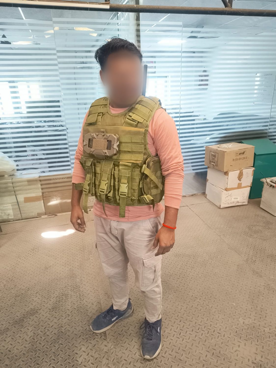 Operator in a plate carrier with a node mounted on the front panel, front view