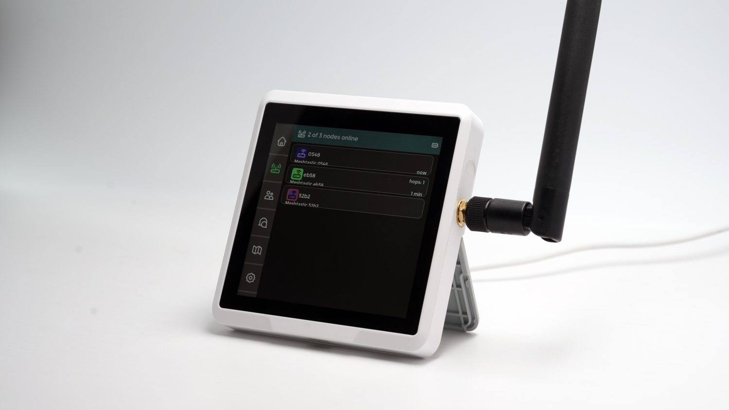 Touchscreen command display on a desk stand showing a live list of mesh nodes online